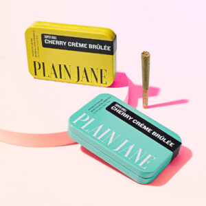 plain-jane-cherry-creme-brulee-6-pack-joints-turquoise-yellow-tins-group-shot-on-white-background-with-one-joint-on-the-outside___00904.1705087521