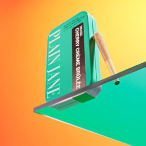 plain-jane-cherry-creme-brulee-blue-tin-amber-background___07268.1736038496