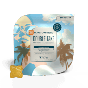 bag of gummies and yellow gummy in front